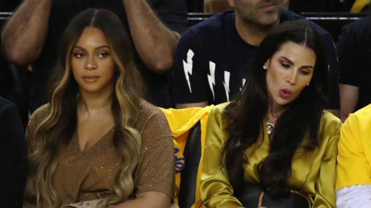Beyonce, left, and Nicole Curran, wife of Golden State Warriors majority owner Joseph Lacob, at Game 3 of the NBA Finals on Wednesday night in Oakland.