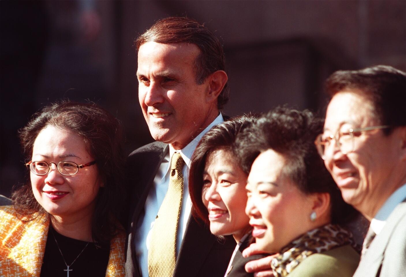 Then-Chief Deputy Lee Baca poses with a group of supporters for a photo in downtown Los Angeles following his announcement that he is a candidate for L.A. County sheriff on January 22, 1998.