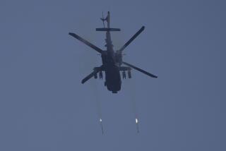 A U.S. Army AH-64 Apache attack helicopter fires rockets to engage a target during Super Garuda Shield 2022 joint military exercises in Baturaja, South Sumatra, Indonesia, Friday, Aug. 12, 2022. The United States and Indonesian militaries conducted the annual combat exercises on Indonesia's Sumatra island, joined for the first time by participants from other partner nations including Australia, Japan and Singapore, signaling stronger ties amid growing maritime activity by China in the Indo-Pacific region. (AP Photo/Dita Alangkara)