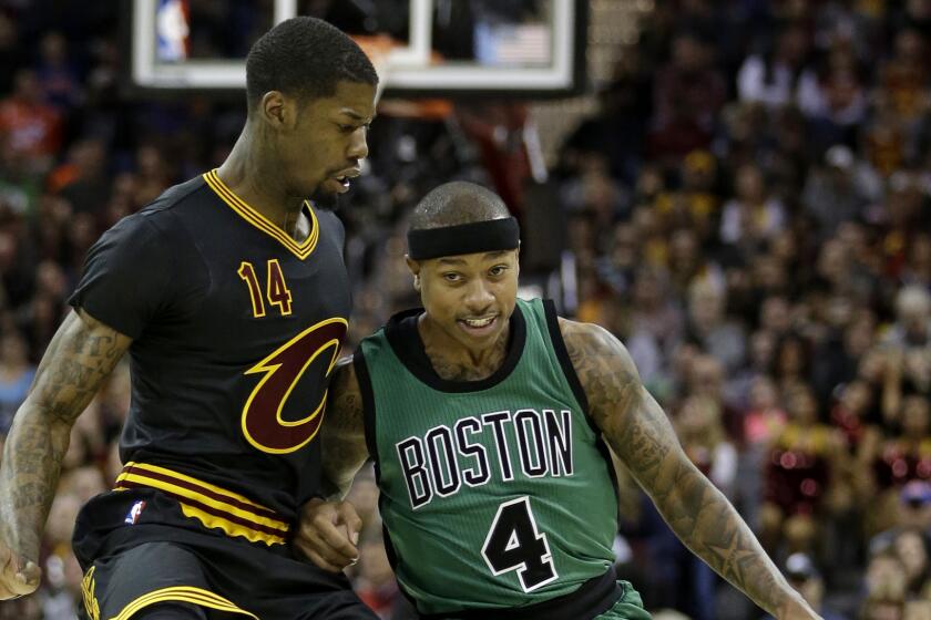 Boston Celtics' Isaiah Thomas (4) drives against Cleveland Cavaliers' DeAndre Liggins (14) in the first half of an NBA basketball game, Thursday, Dec. 29, 2016, in Cleveland. (AP Photo/Tony Dejak)
