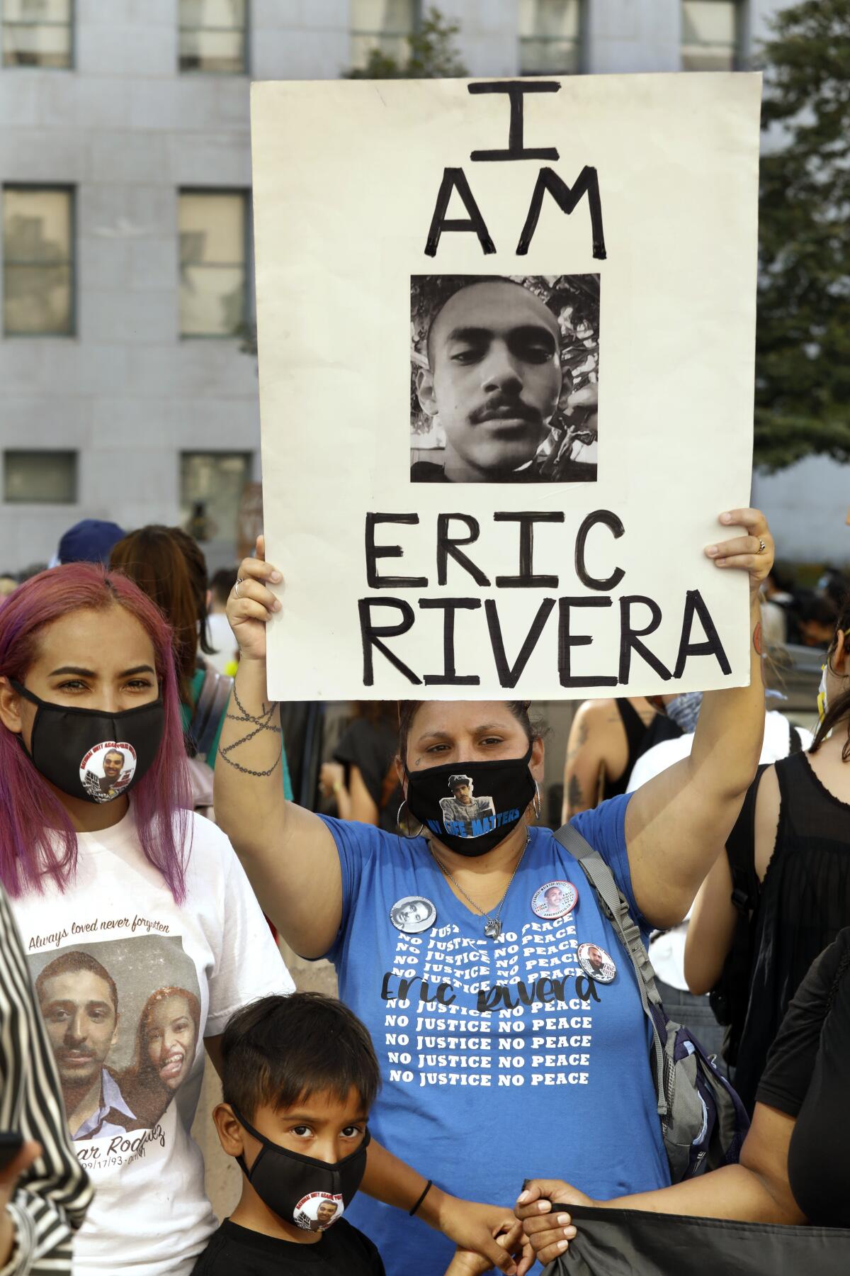 Evelia Granado, left, 5-year-old Isaiah Valdovinos and Valerie Rivera at a June 24 rally in downtown L.A.