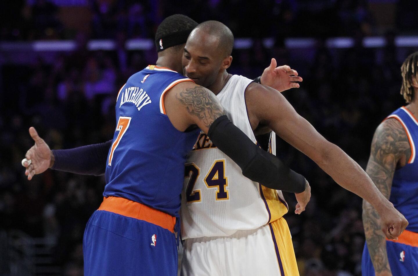 Knicks forward Carmelo Anthony (7) hugs Lakers forward Kobe Bryant (24) prior to their game Sunday at Staples Center.