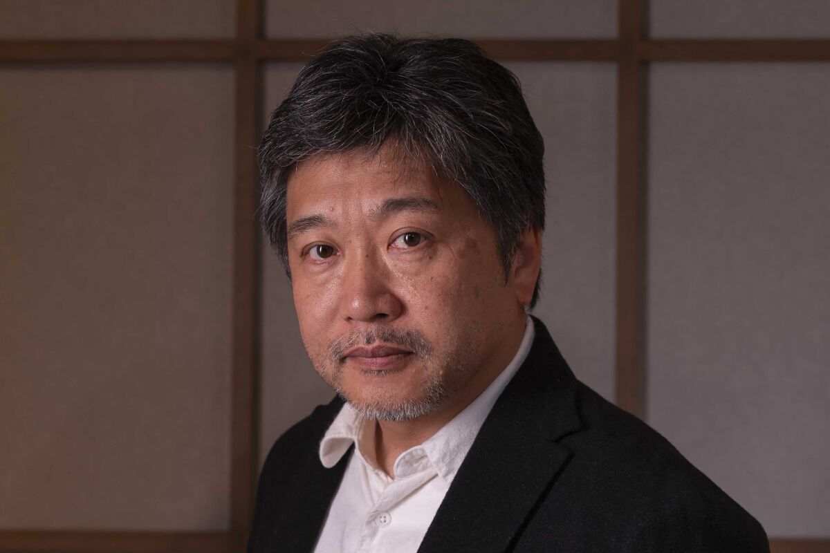 FILE - Japanese director Hirokazu Kore-eda poses for portraits during the Rome Film Fest in Rome on Oct. 18, 2019. A #MeToo crisis is raging in the Japanese film industry. A petition signed by top names, including Cannes’ Palme d’Or-winning Kore-eda, Cannes Jury Prize winner Koji Fukada and “Under the Sky” director Miwa Nishikawa, expresses outrage over sexual abuse. (AP Photo/Domenico Stinellis, File)