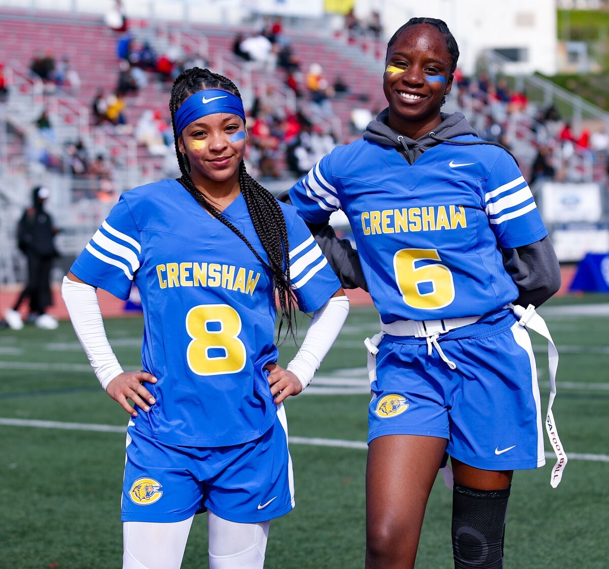Crenshaw High running back De'Chelle Brackett and wide receiver Imani Taylor-Wise pose for a photo.