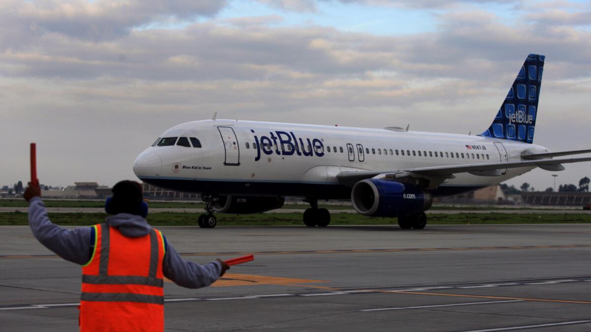 A JetBlue flight from Las Vegas taxis to the Long Beach Airport in December 2012. JetBlue, the largest carrier at the airport, called for a feasibility study on allowing international flights.