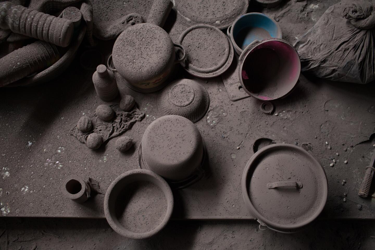 Kitchen utensils caked in ash