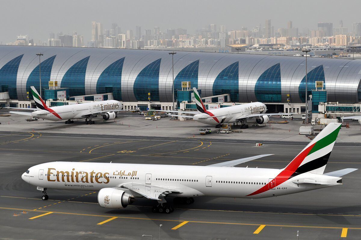 FILE - An Emirates plane taxis to a gate at Dubai International Airport at Dubai International Airport in Dubai, United Arab Emirates, on Wednesday, March 22, 2017. One of the world’s biggest airlines and the Mideast’s top carrier, Emirates Air, said Friday, May 13, 2022, it lost $1.1 billion over the past fiscal year, but the figure still marks an 80% improvement from the year before. The airline said revenue was up 91%, reaching $16.1 billion. (AP Photo/Adam Schreck, File)