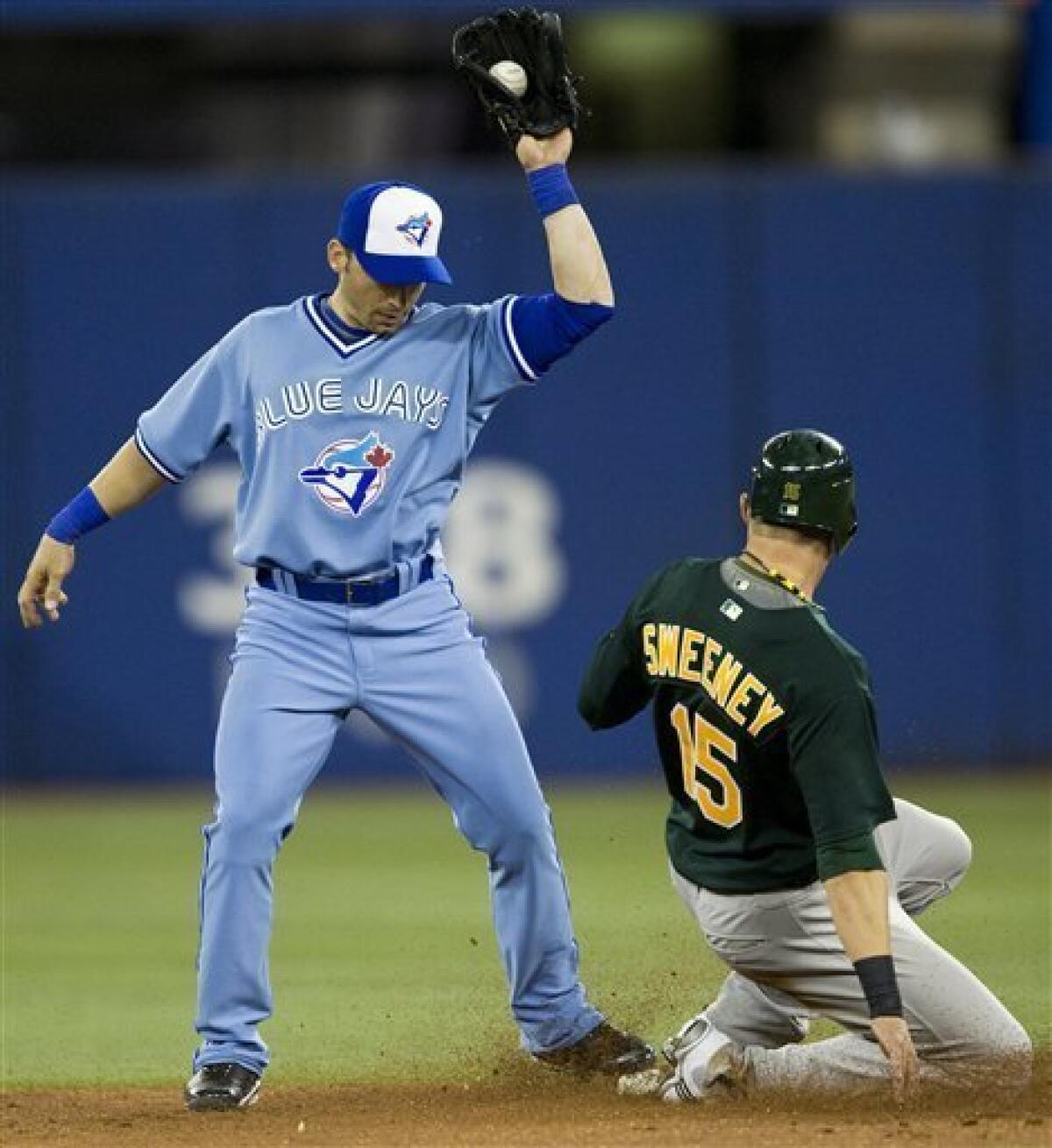 Oakland Athletics shortstop Orlando Cabrera reaches to put the tag