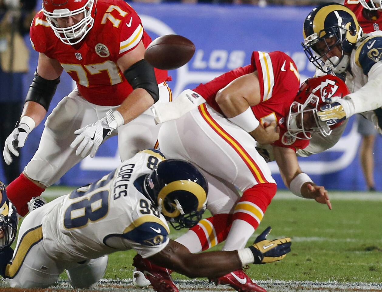 LOS ANGELES, CALIF. - AUG. 20, 2016. The Rams defense forces a fumble by Chiefs quarterback Aaron Murray in the fourth quarter on a game at the Coliseum on Aug. 20.