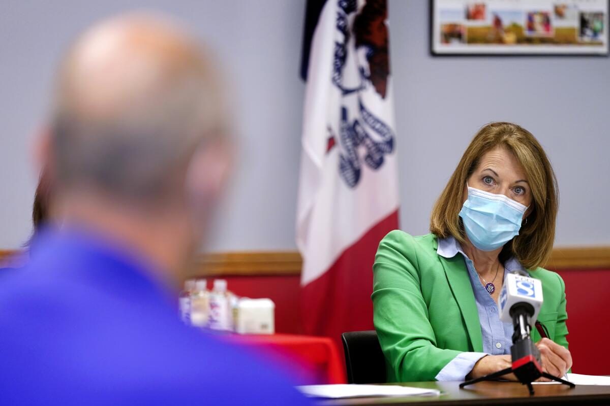 In this Sept. 2, 2021, photo Rep. Cindy Axne, D-Iowa, speaks about the Rural Reinvestment Task Force during a meeting with local officials in Indianola, Iowa. (AP Photo/Charlie Neibergall)