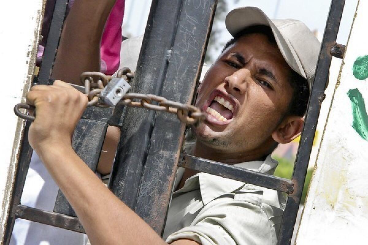 An Egyptian border policeman protests the abduction of seven colleagues last week in northern Sinai. The protest has closed the Gaza Strip border crossing.