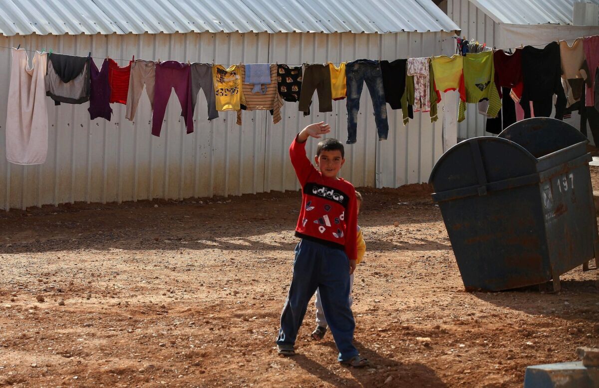 A Syrian child gestures at Azraq Syrian refugee camp in Jordan on Jan. 30.