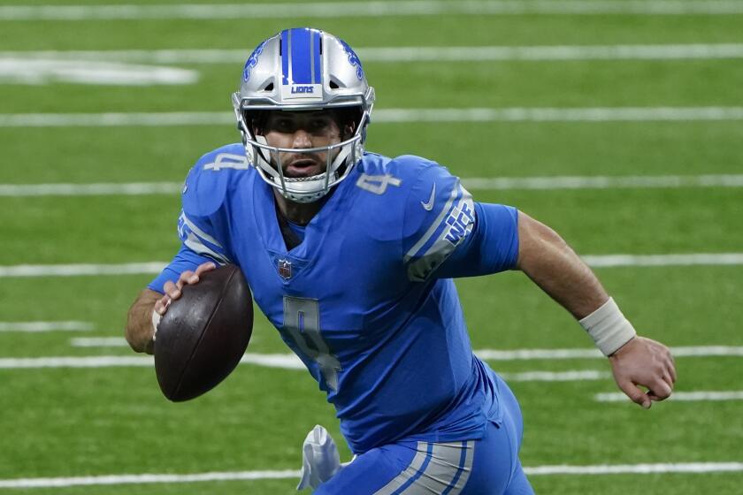 Detroit Lions quarterback Chase Daniel runs the ball against the Green Bay Packers during the second half.