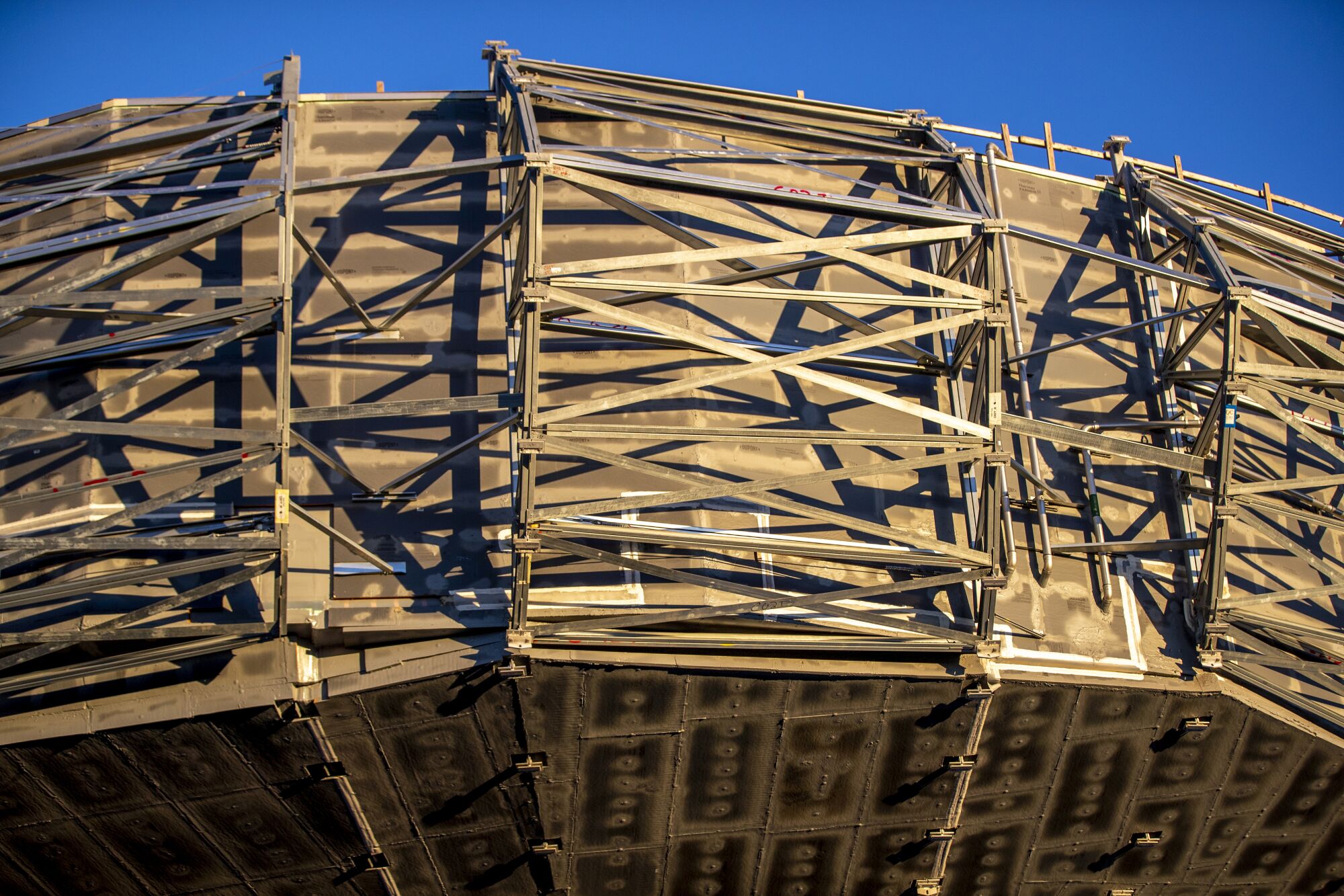 Framework of crisscrossed beams surrounds the museum