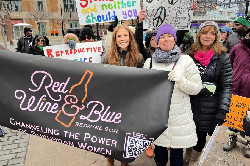 Cleveland, Ohio-March 2023-Katie Paris, founder of Red Wine & Blue, rallies for abortion rights alongside supporters at the Cleveland Women's March in 2023 at Cleveland's Market Square Park in Ohio. (Courtesy of Red Wine & Blue)