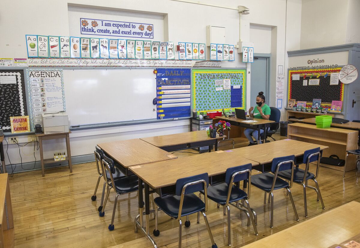 A fifth-grade teacher in South Los Angeles talks to her student on Zoom.