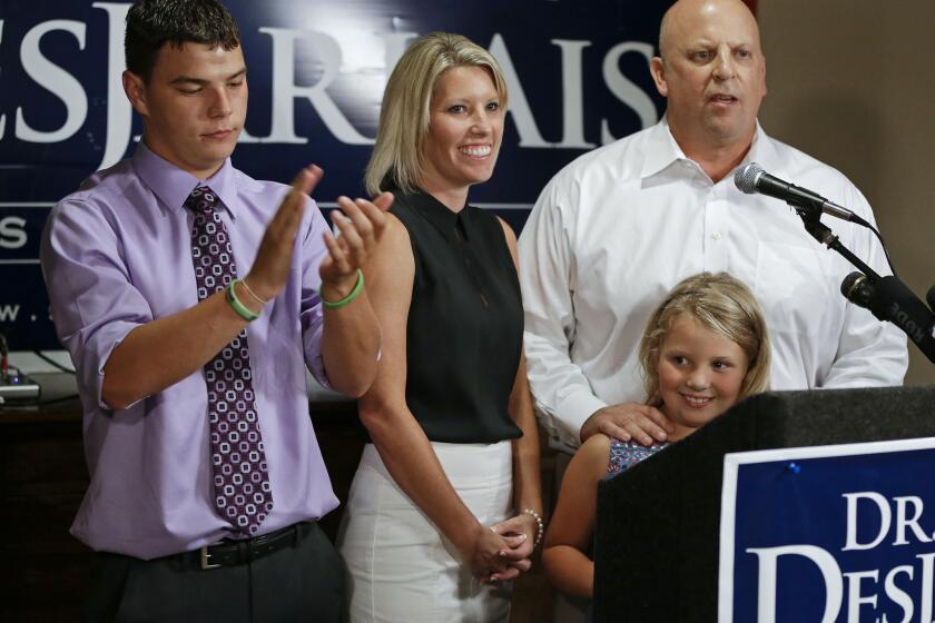 Rep. Scott DesJarlais (R-Tenn.), right, speaks to supporters in South Pittsburg, Tenn. With him are his wife, Amy, his stepson, Tyler Privette, left, and daughter, Maggie, 7.