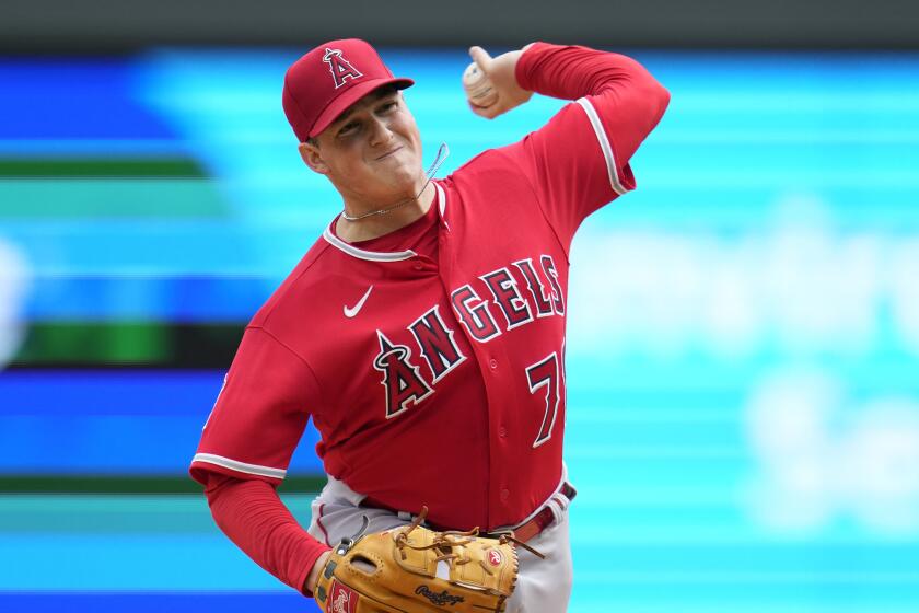Los Angeles Angels starting pitcher Kenny Rosenberg delivers during the first inning.