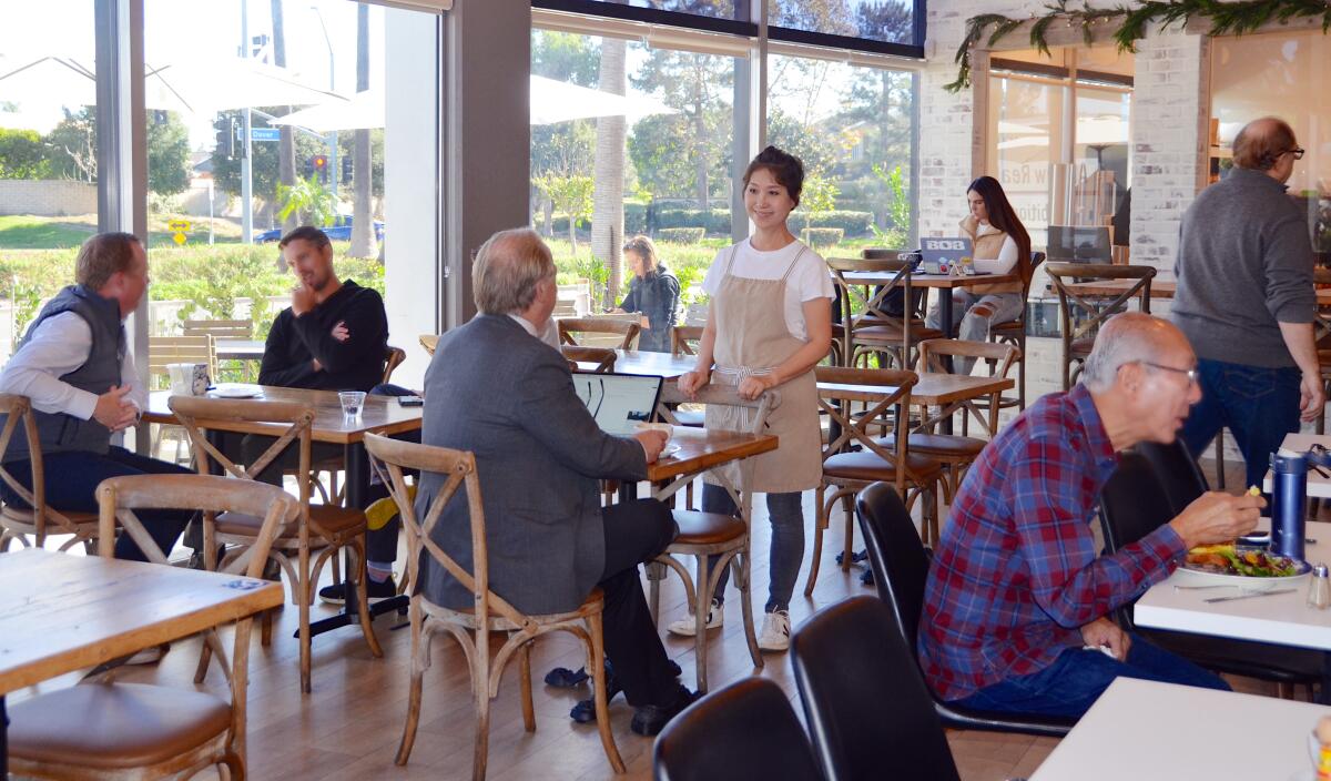 Juliette Chung greets diners inside Juliette's Cafe & Coffee Culture.