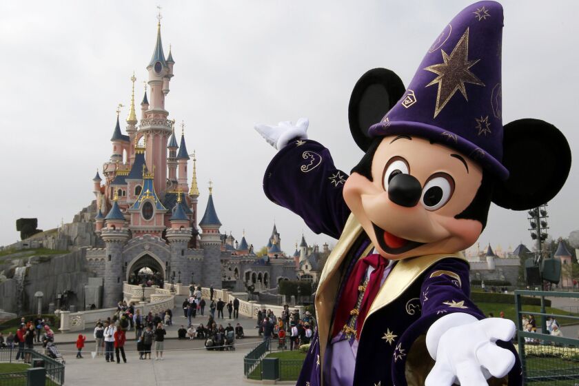 Mickey posing in front of the Sleeping Beauty Castle at Disneyland park, in Chessy, near Marne-la-Vallee, outside Paris.