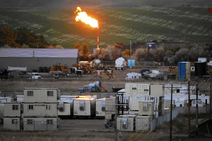 A natural gas flame in Williston, N.D., in 2014.
