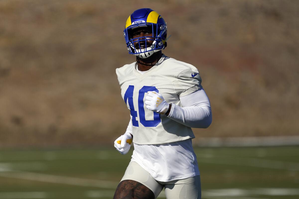 Los Angeles Rams outside linebacker Von Miller runs on the field during NFL football practice.