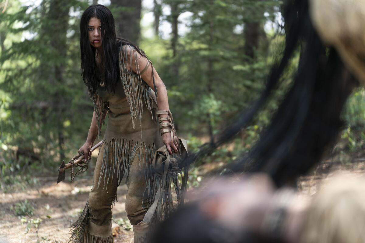 A young Comanche woman (played by Amber Midthunder) faces down a space hunter from the "Predator" franchise, in "Prey."