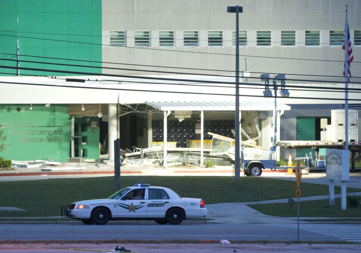 A police car is parked outside the Escambia County Central Booking and Detention Center on May 1 in in Pensacola, Fla., following a natural gas explosion.