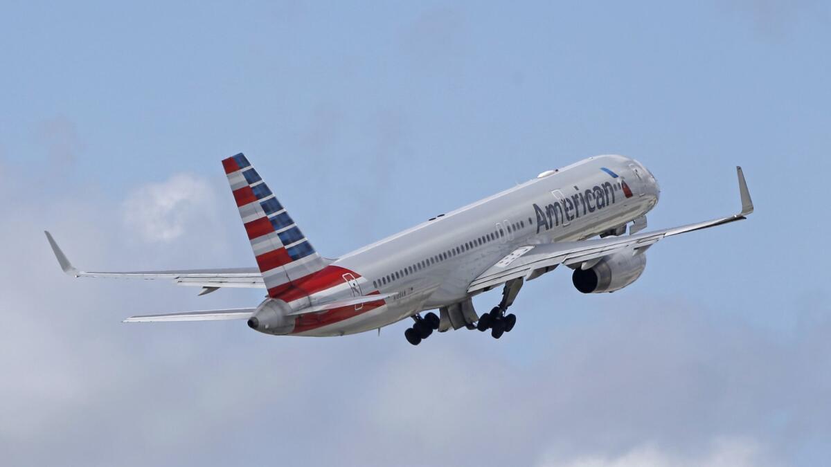 An American Airlines passenger jet takes off from Miami International Airport. American Airlines has agreed to pay $45 million to settle an antitrust lawsuit that claimed several airlines colluded to keep capacity low. The airline denies the charge.