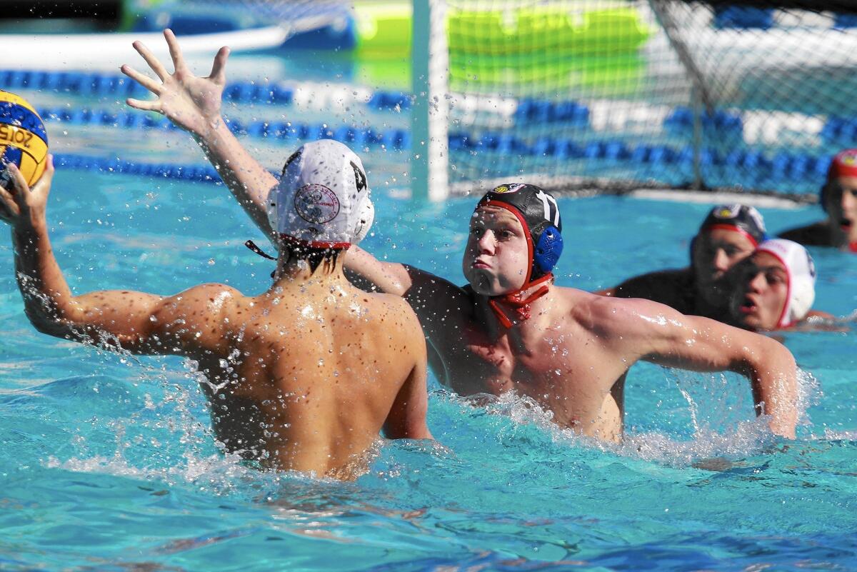 Regency Water Polo's Jackson Seybold rises up to score during the first half against Stanford in the 2015 USA Junior Olympics 18U boys' bronze match at the William Woollett Aquatic Center in Irvine on Tuesday.