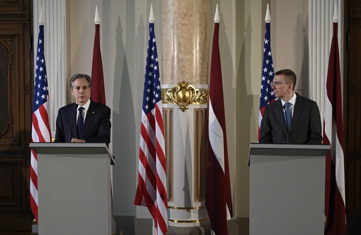 US Secretary of State Antony Blinken, left, and Latvia's Foreign Minister Edgars Rinkevics hold a press conference at the National Art Museum in Riga, Latvia, Monday March 7, 2022. U.S. Secretary of State Antony Blinken is on a lightning visit to the three Baltic states that are increasingly on edge as they watch Russia press ahead with its invasion of Ukraine. The former Soviet republics of Latvia, Lithuania and Estonia are all members of NATO and Blinken assured them of the alliance’s protection in the event Russia expands its military operations. (Olivier Douliery/Pool via AP)