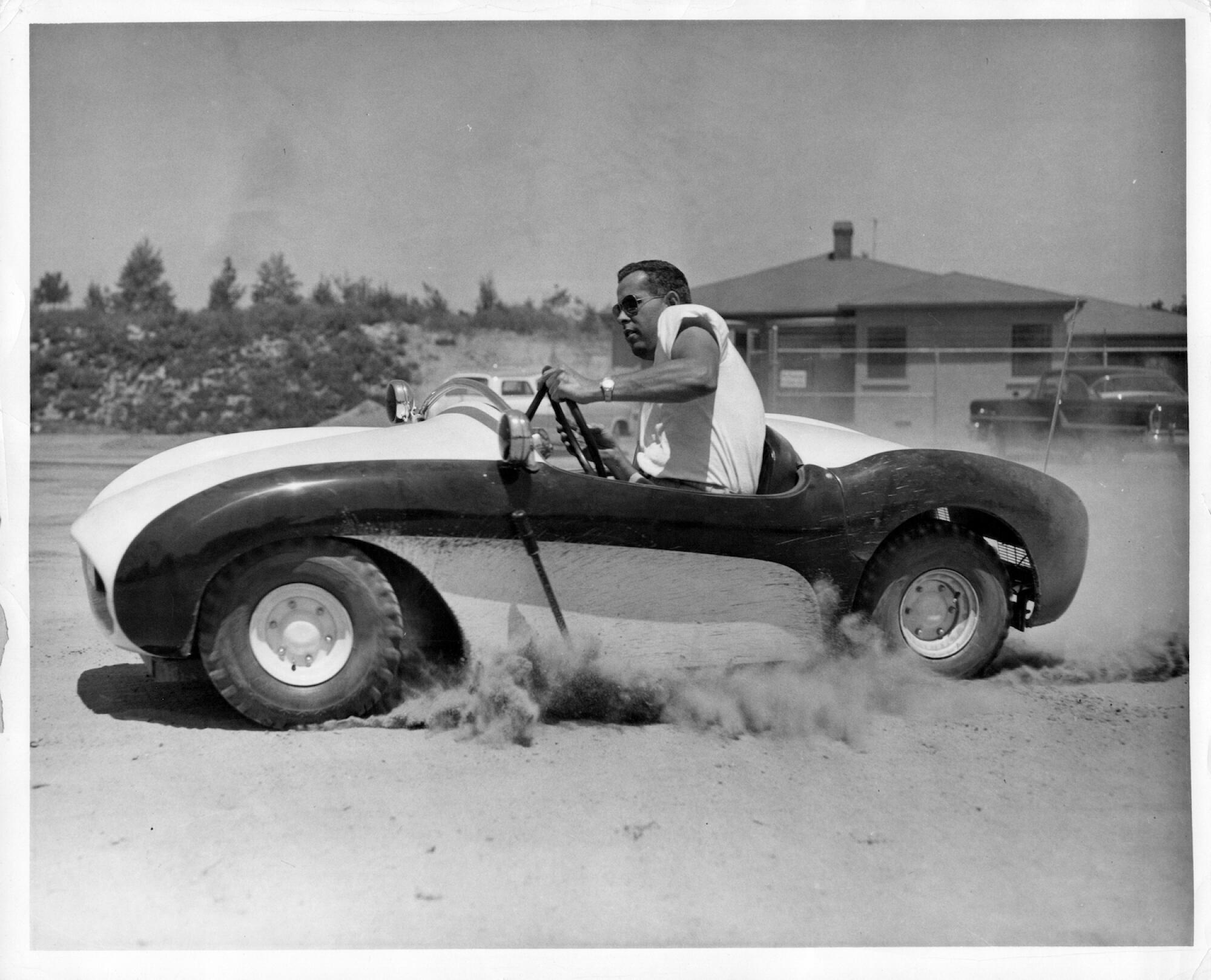 A young man in a striped car.