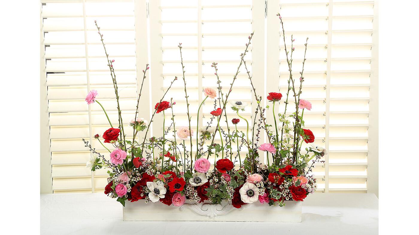 This garden screen from Dandelion Ranch contains peach branches, ranunculus, anemones, larkspur, leptospermum, wax flower, ivy and pittosporum. $400. Other sizes are available starting at $185. www.dandelionranch.com