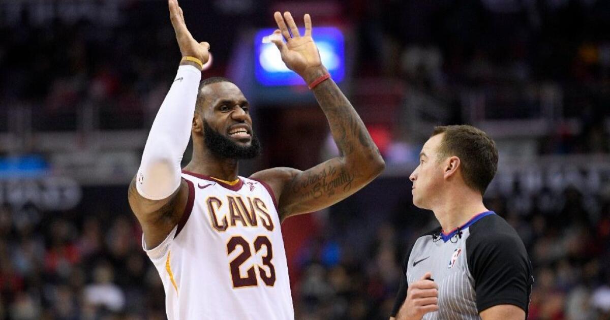 NBA  In special shoes, LeBron's triple-double leads Cavs past Wizards,  106-99