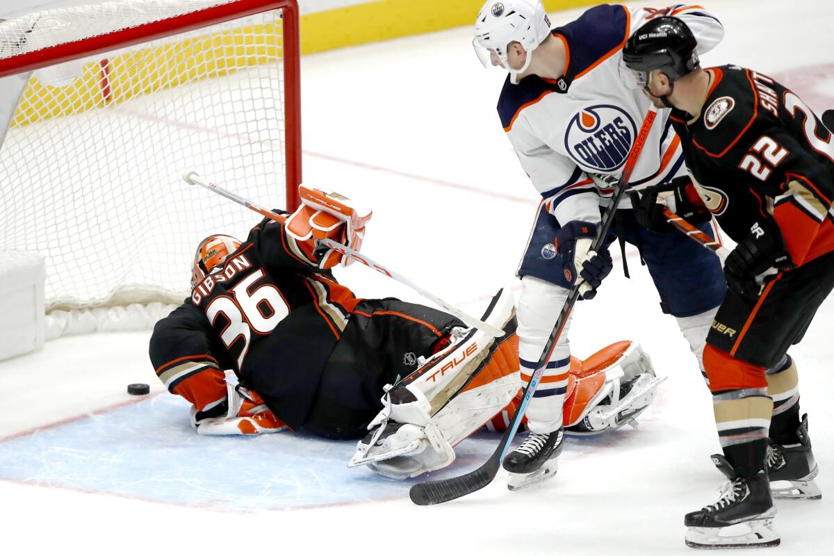 Ducks goaltender John Gibson watches the puck cross the goal line as in front of Zach Hyman and Kevin Shattenkirk.