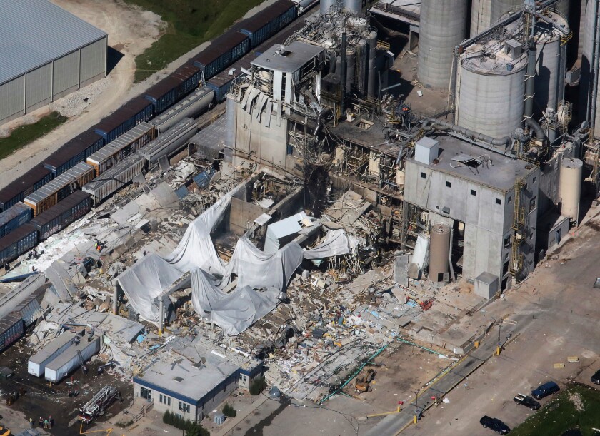 FILE - Part of the Didion Milling Plant in Cambria, Wis., lies in ruins following an explosion in this June 1, 2017 photo,. A federal grand jury has charged a milling company with fraud and conspiracy in connection with the explosion that killed five workers in 2017. Court records indicate the grand jury indictment was announced Thursday, May 12, 2022, against Didion Milling Inc. and company leaders. (John Hart/Wisconsin State Journal via AP, File)