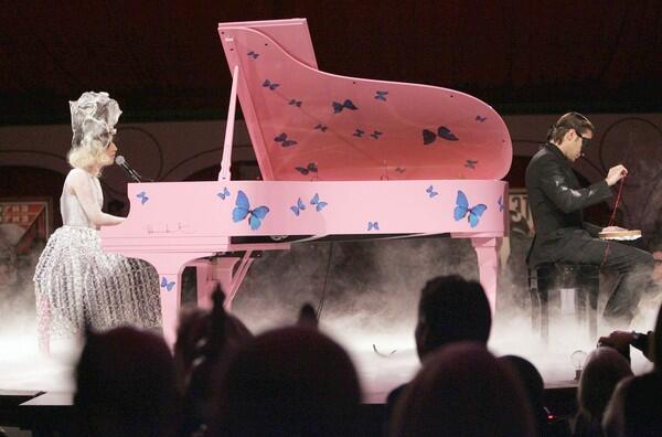 Artist Francesco Vezzoli, right, and Lady Gaga perform during the Museum of Contemporary Art celebration in Los Angeles.