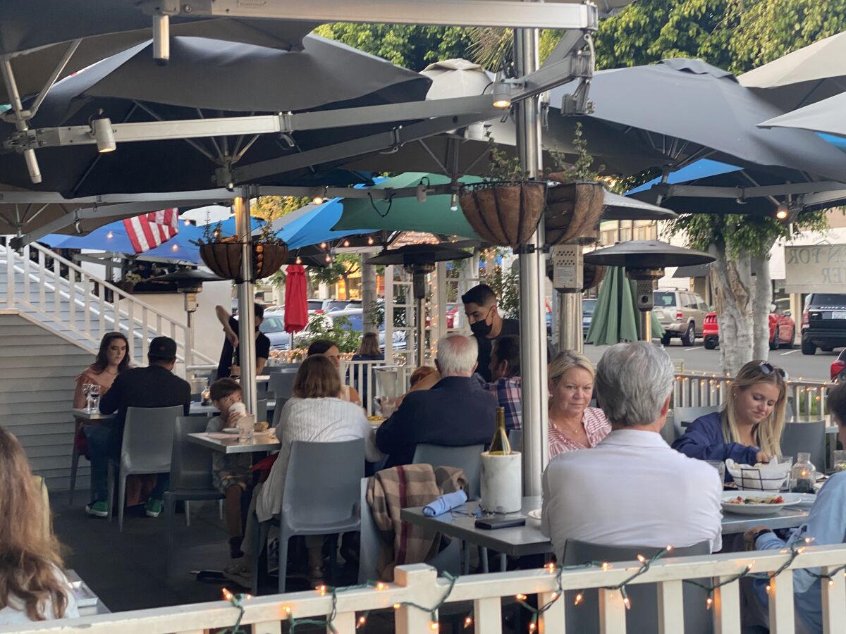 The Cottage restaurant on Fay Avenue in La Jolla will not increase tables to full capacity for several months.