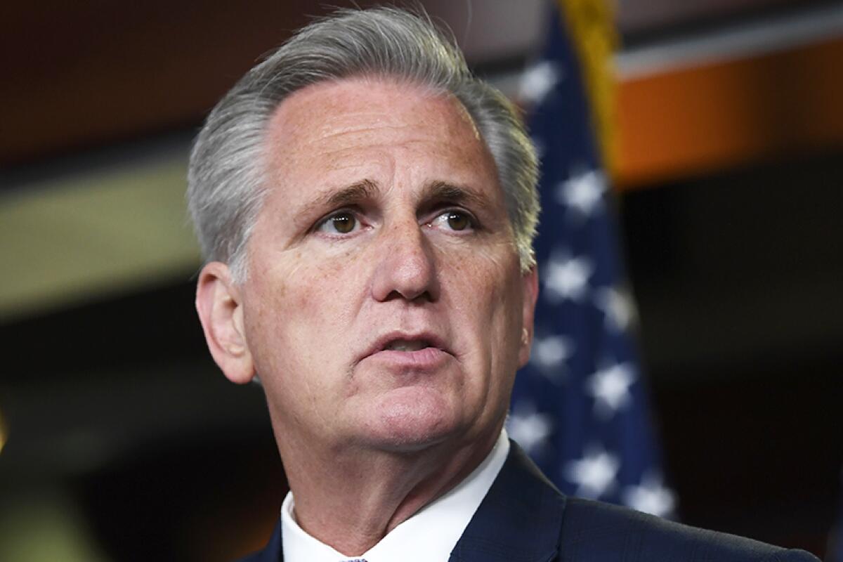 Close-up portrait of House Minority Leader Kevin McCarthy, wearing a collared shirt and suit jacket.