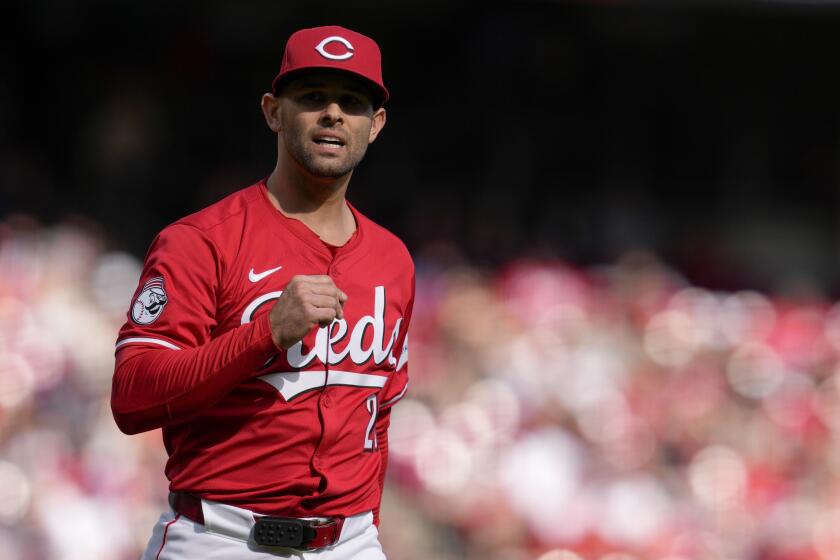 Cincinnati Reds pitcher Nick Martinez reacts after New York Mets' Pete Alonso flies out during the third inning of a baseball game Saturday, April 6, 2024, in Cincinnati. (AP Photo/Jeff Dean)