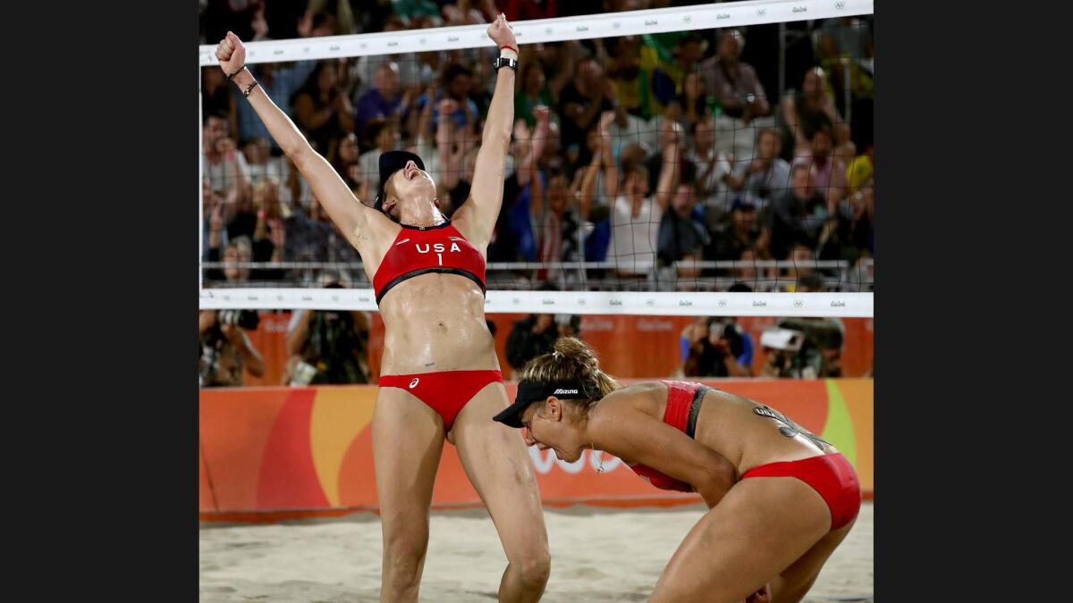 USA's Kerri Walsh Jennings, left, celebrates with partner April Ross after capturing the bronze medal during the women's beach volleyball match.