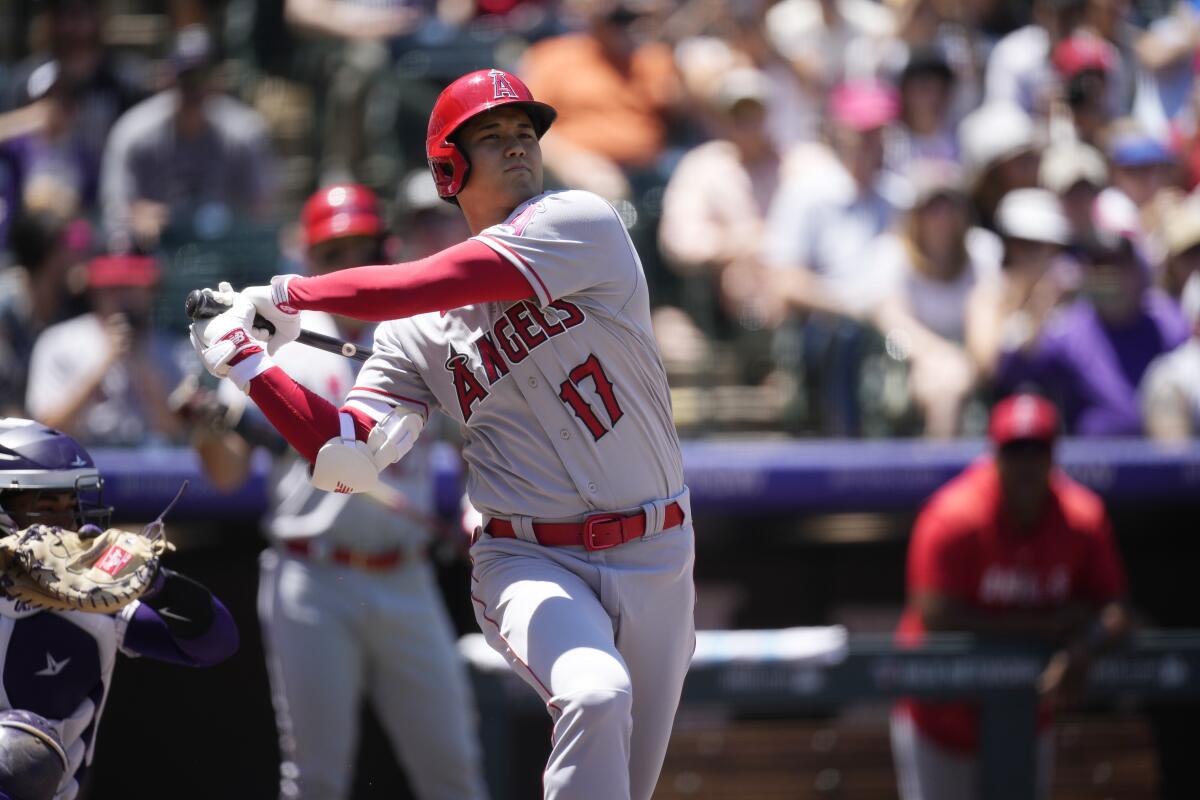 Angels star Shohei Ohtani swings at a pitch during the first inning Sunday against the Colorado Rockies.