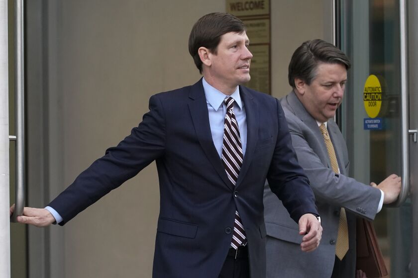 Former Republican state Sen. Brian Kelsey, left, leaves federal court Tuesday, Nov. 22, 2022, in Nashville, Tenn. Kelsey changed an earlier plea of not guilty to guilty Tuesday, on charges of violating federal campaign finance laws. (AP Photo/Mark Humphrey)