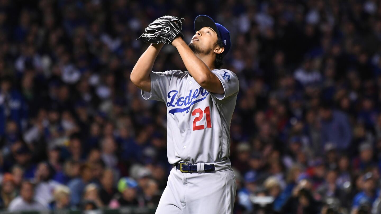 Dodgers pitcher Yu Darvish looks to the sky while walking off the field after being taken out of the game in the seventh inning of Game 3.