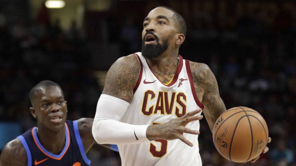 Cleveland Cavaliers' JR Smith (5) drives past Oklahoma City Thunder's Dennis Schroder (17) in the first half game on Nov. 7, 2018 in Cleveland.