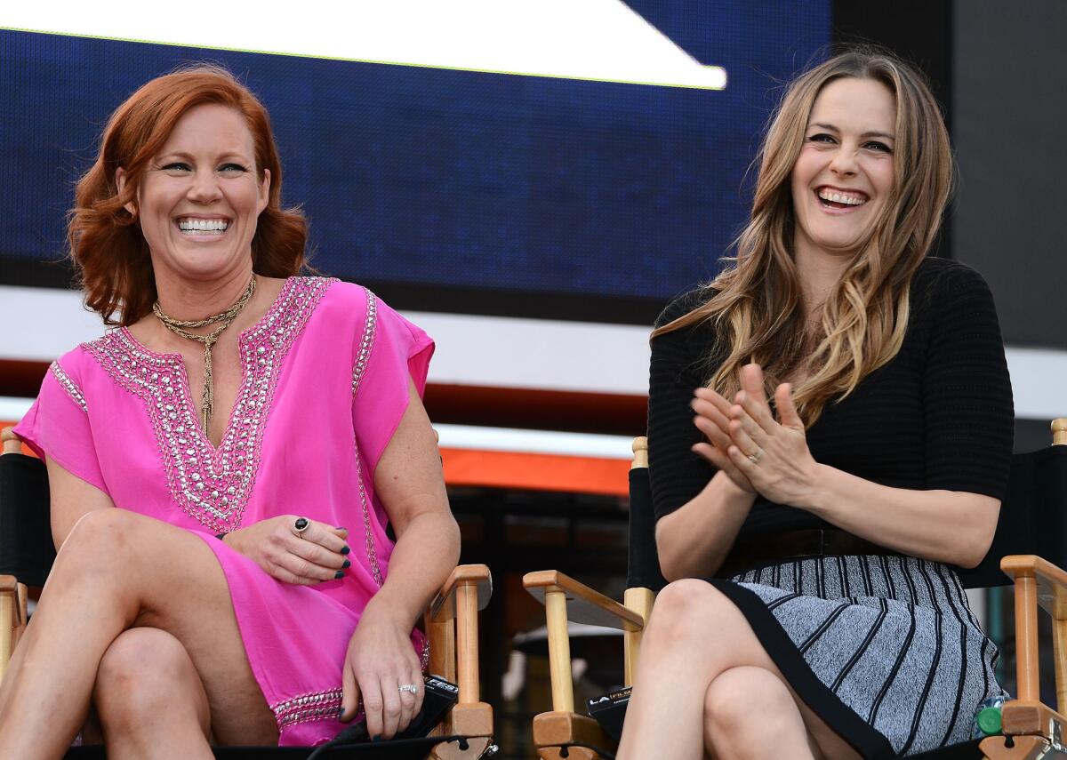 Alicia Silverstone, right, and "Clueless" costar Elisa Donovan attend the L.A. Film Festival's pre-festival outdoor screening of the 1995 comedy at L.A. Live on Tuesday.