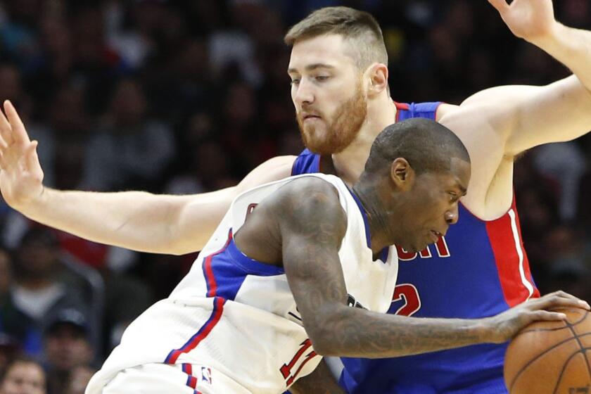 Jamal Crawford dribbles past Detroit's Aron Baynes during the Clippers' 101-96 victory Saturday at Staples Center.