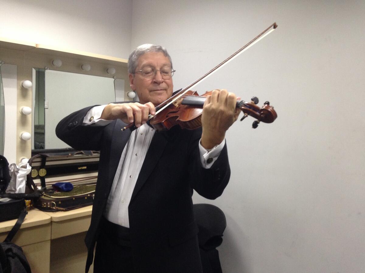 Jack Cobos, a violinist from Georgia, is on his second tour with the group. He's turning 71 during this trip and previously played with the Chattanooga Symphony.