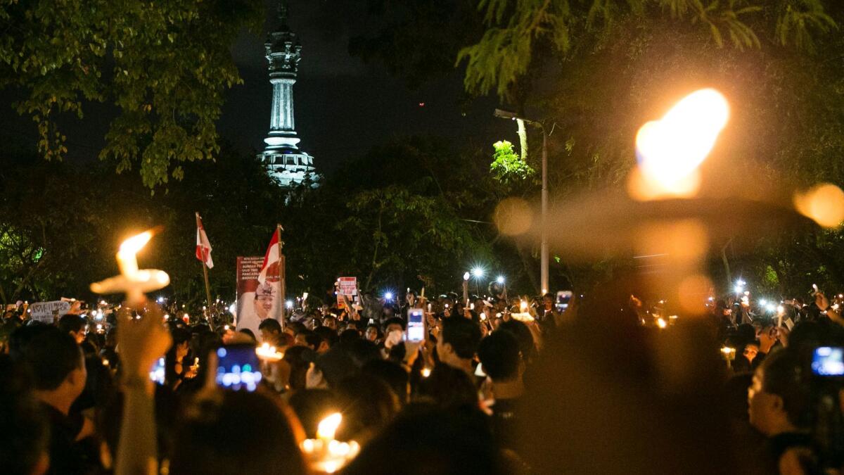 Supporters march in support of Jakarta's former governor Basuki Tjahaja Purnama, of May 11, after an Indonesian court sentenced him to two years in jail for blasphemy.