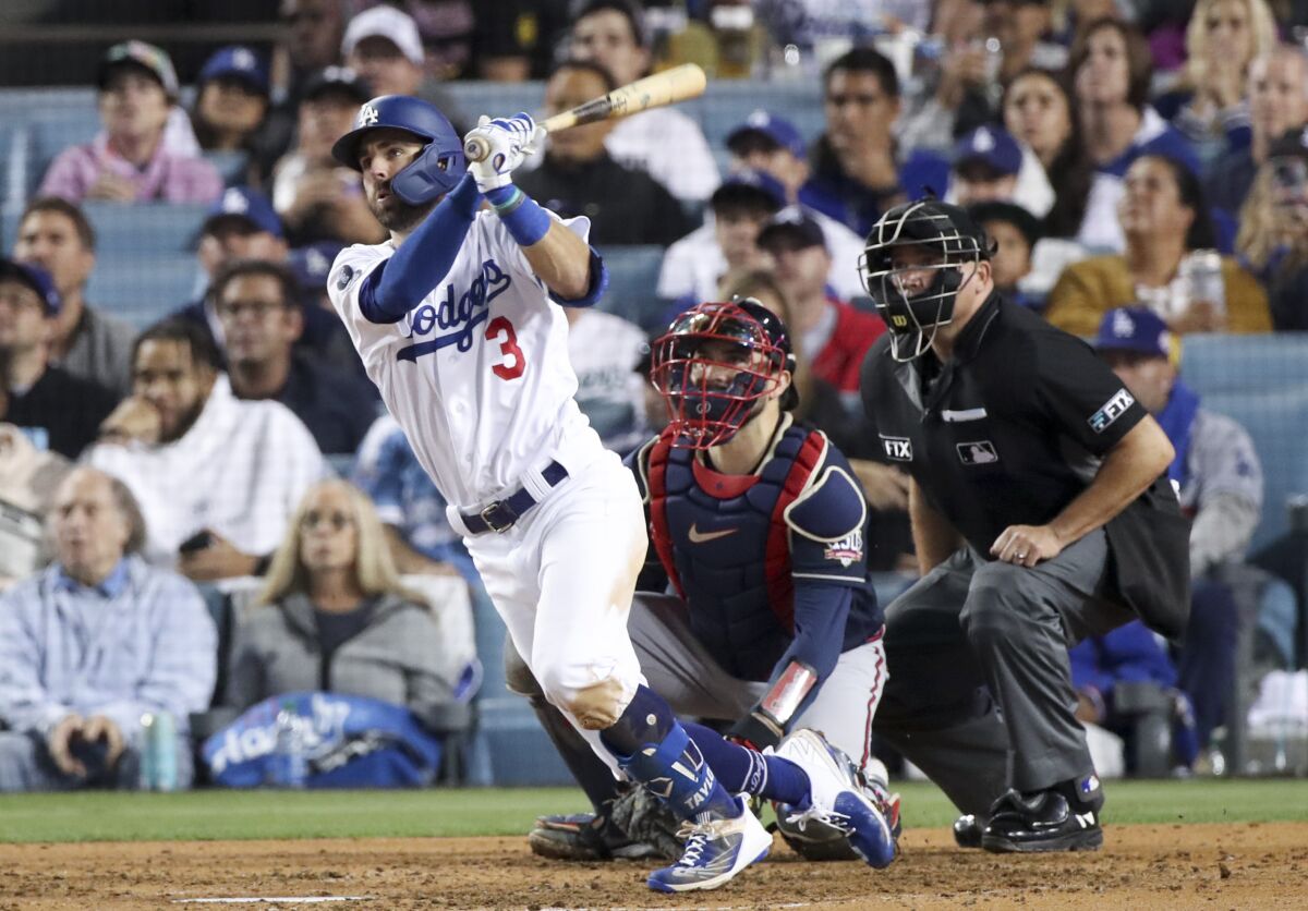 Chris Taylor hits a home run for the Dodgers against the Atlanta Braves in the playoffs on Oct. 21, 2021.